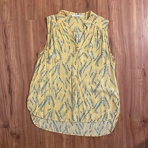 Sleeveless dress top from Stitch Fix. It’s yellow with blue flowers.